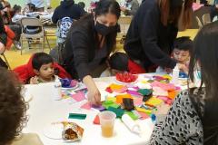 Families from the Catholic Charities Charles F. Murphy Early Childhood Development Center participate in arts and craft projects during a Read Across America celebration.
