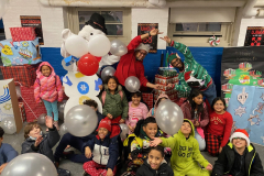 Students from the Catholic Charities COMPASS at PS 160 pose for a group photo during a Winter Wonderland event in Brooklyn.